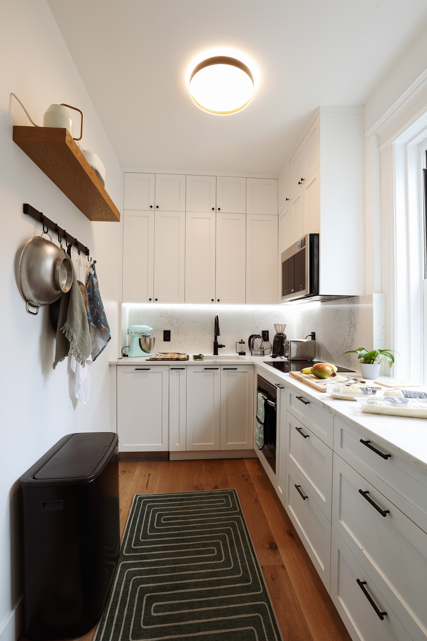 Kitchen — white shaker cabinetry with matte black hardware